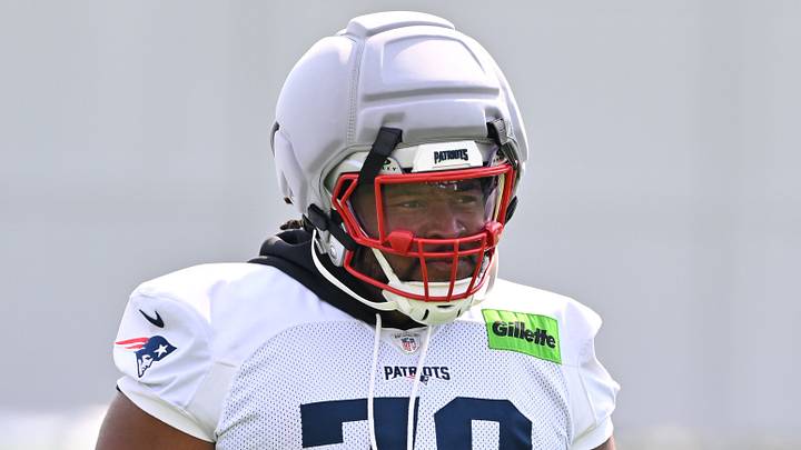 New England Patriots offensive tackle Caedan Wallace walks to practice for training camp at Gillette Stadium.