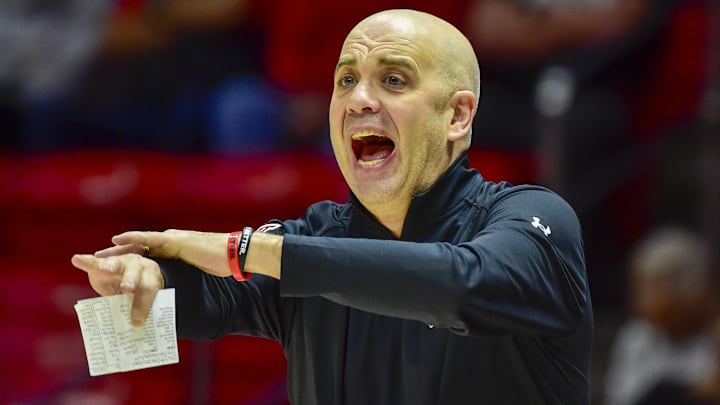 Feb 15, 2025; Salt Lake City, Utah, USA; Utah Utes head coach Craig Smith reacts to a call against the Kansas Jayhawks during the first half at the Jon M. Huntsman Center. 