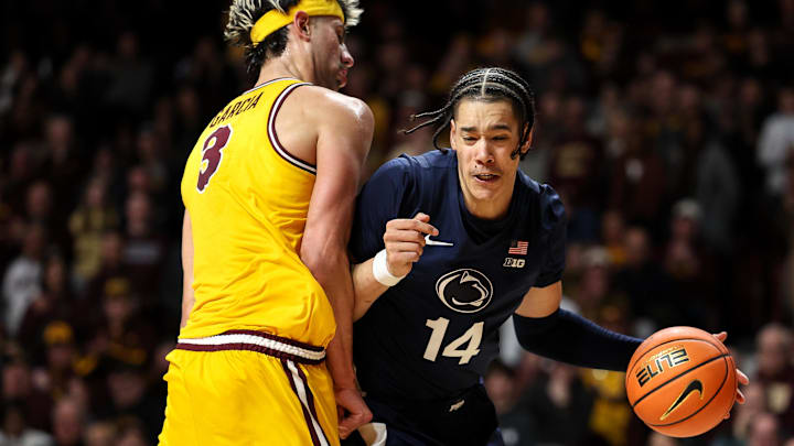Feb 22, 2025; Minneapolis, Minnesota, USA; Penn State Nittany Lions forward Yanic Konan Niederhauser (14) works around Minnesota Golden Gophers forward Dawson Garcia (3) during the second half at Williams Arena. Mandatory Credit: Matt Krohn-Imagn Images