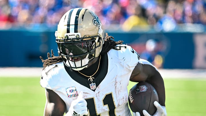 Sep 28, 2025; Orchard Park, New York, USA; New Orleans Saints running back Alvin Kamara (41) carries the ball against the Buffalo Bills in the third quarter at Highmark Stadium. Mandatory Credit: Mark Konezny-Imagn Images