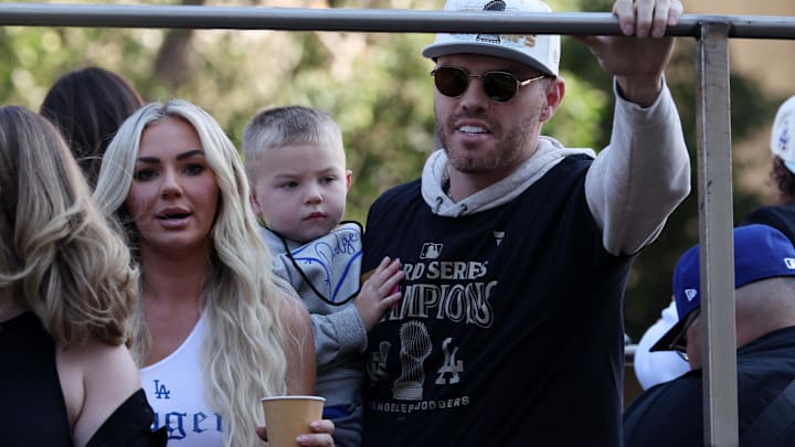 Los Angeles Dodgers first base Freddie Freeman (celebrates with his wife Chelsea Freeman during the 2024 World Series Championship parade.