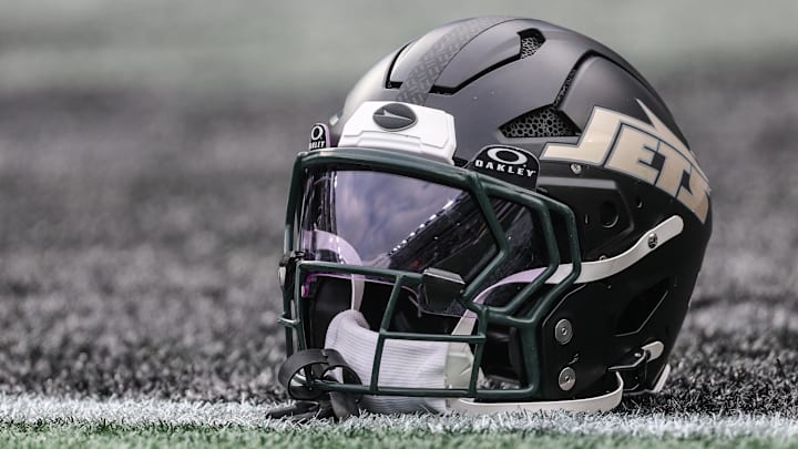 Dec 7, 2025; East Rutherford, New Jersey, USA; A general view of a Gotham City football rivalries helmet resting on the field before the game against the Miami Dolphins at MetLife Stadium. Mandatory Credit: Vincent Carchietta-Imagn Images Dec 7, 2025; East Rutherford, New Jersey, USA; A general view of a Gotham City football rivalries helmet resting on the field before the game against the Miami Dolphins at MetLife Stadium. Mandatory Credit: Vincent Carchietta-Imagn Images