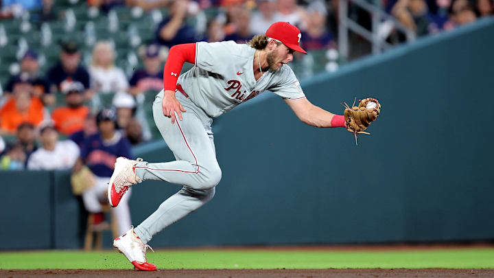 Jun 24, 2025; Houston, Texas, USA; Philadelphia Phillies third baseman Alec Bohm (28) fields a batted ball from Houston Astros shortstop Jeremy Pena (3, not shown) during the first inning at Daikin Park. 
