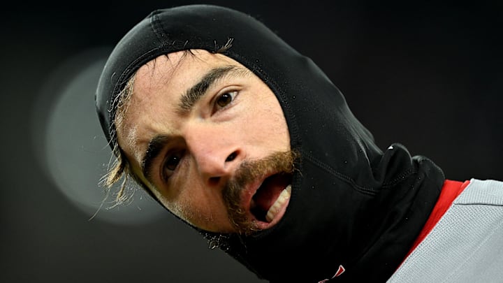 Apr 5, 2026; Detroit, Michigan, USA;  St. Louis Cardinals shortstop Thomas Saggese (25) waits for a teammate to bring him his hat and glove after making the third out against the Detroit Tigers in the sixth inning at Comerica Park. Mandatory Credit: Lon Horwedel-Imagn Images
