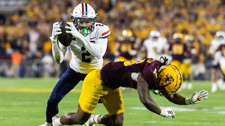 Nov 28, 2025; Tempe, Arizona, USA; Arizona Wildcats defensive back Treydan Stukes (2) intercepts the ball against Arizona State Sun Devils wide receiver Jaren Hamilton (16) in the second half during the 99th Territorial Cup at Mountain America Stadium. Mandatory Credit: Mark J. Rebilas-Imagn Images Nov 28, 2025; Tempe, Arizona, USA; Arizona Wildcats defensive back Treydan Stukes (2) intercepts the ball against Arizona State Sun Devils wide receiver Jaren Hamilton (16) in the second half during the 99th Territorial Cup at Mountain America Stadium. Mandatory Credit: Mark J. Rebilas-Imagn Images