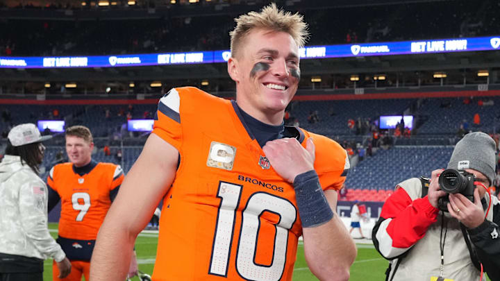 Nov 17, 2024; Denver, Colorado, USA; Denver Broncos quarterback Bo Nix (10) reacts following the win over the Atlanta Falcons at Empower Field at Mile High. 