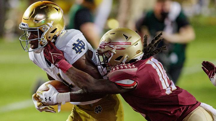 Notre Dame Fighting Irish wide receiver Kevin Austin Jr. (4) scores a touchdown as Florida State Seminoles defensive back Travis Jay (18) tackles him in the end zone. The Notre Dame Fighting Irish defeat the Florida State Seminoles 41-38 at Doak Campbell Stadium on Sunday, Sept. 5, 2021.

Fsu V Notre Dame1140