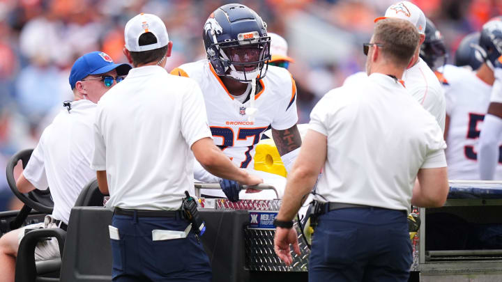 Aug 25, 2024; Denver, Colorado, USA; Denver Broncos cornerback Damarri Mathis (27) leaves the field after an injury in the first quarter against the Arizona Cardinals at Empower Field at Mile High. Mandatory Credit: Ron Chenoy-USA TODAY Sports