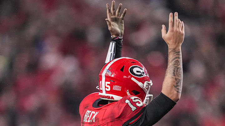Georgia Bulldogs quarterback Carson Beck (15) reacts after throwing a touchdown pass against the Mississippi Rebels. Georgia Bulldogs quarterback Carson Beck (15) reacts after throwing a touchdown pass against the Mississippi Rebels.