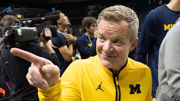 Michigan head coach Dusty May embraced the road atmosphere during pregame on Friday night at Michigan State. Michigan head coach Dusty May embraced the road atmosphere during pregame on Friday night at Michigan State.