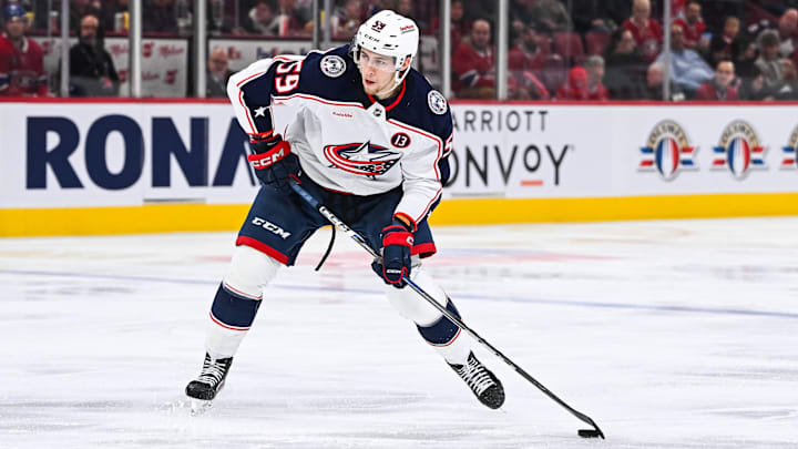 Nov 16, 2024; Montreal, Quebec, CAN;Columbus Blue Jackets right wing Yegor Chinakhov (59) plays the puck against the Montreal Canadiens  during the third period at Bell Centre. Mandatory Credit: David Kirouac-Imagn Images