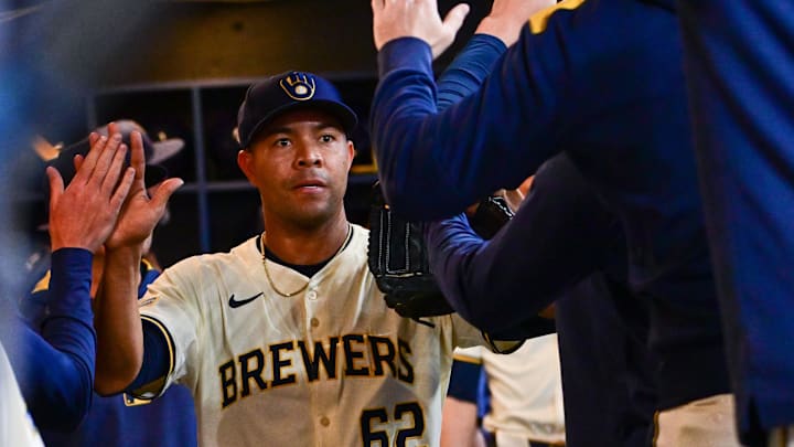 Apr 16, 2025; Milwaukee, Wisconsin, USA; Milwaukee Brewers starting pitcher Jose Quintana (62) is greeted in the dugout after pitching five plus innings against the Detroit Tigers at American Family Field. Mandatory Credit: Benny Sieu-Imagn Images
