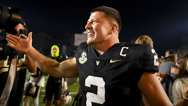 Nov 8, 2025; Nashville, Tennessee, USA;  Vanderbilt Commodores quarterback Diego Pavia (2) celebrates the win against the Auburn Tigers during the overtime period at FirstBank Stadium. Mandatory Credit: Steve Roberts-Imagn Images