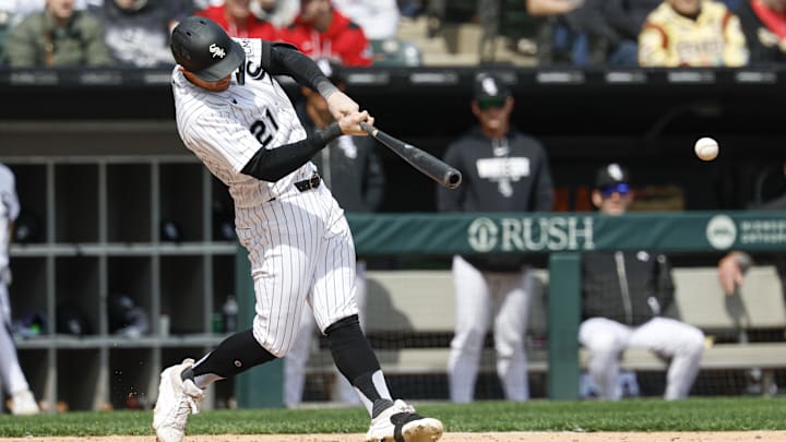 Apr 3, 2026; Chicago, Illinois, USA; Chicago White Sox left fielder Austin Hays (21) hits a two-run single against the Toronto Blue Jays during the third inning at Rate Field. Mandatory Credit: Kamil Krzaczynski-Imagn Images