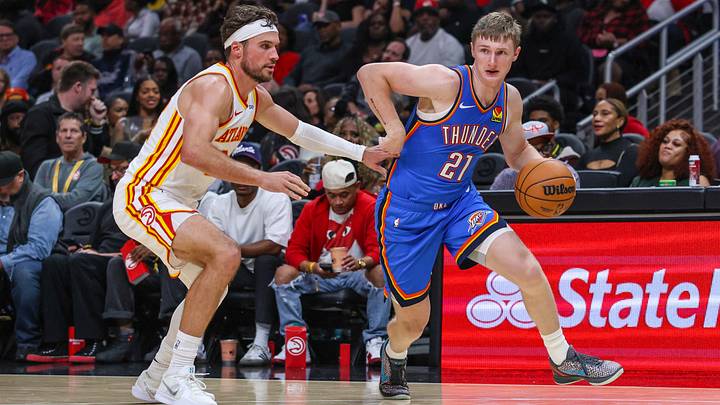 Oct 12, 2026; Atlanta, Georgia, USA; Oklahoma City Thunder guard Josh Dix (21) dribbles against Atlanta Hawks forward Corey Kispert (24) during the third quarter at State Farm Arena. Oct 12, 2026; Atlanta, Georgia, USA; Oklahoma City Thunder guard Josh Dix (21) dribbles against Atlanta Hawks forward Corey Kispert (24) during the third quarter at State Farm Arena.