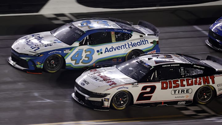 NASCAR Cup Series driver Austin Cindric (2) and driver Erik Jones (43) race side by side during Duel 2 at Daytona International Speedway. NASCAR Cup Series driver Austin Cindric (2) and driver Erik Jones (43) race side by side during Duel 2 at Daytona International Speedway.