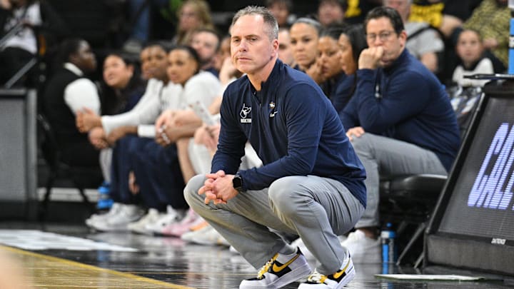 Mar 23, 2024; Iowa City, IA, USA; West Virginia Mountaineers head coach Mark Kellogg looks on during the first quarter against the Princeton Tigers of the NCAA first round game at Carver-Hawkeye Arena. Mandatory Credit: Jeffrey Becker-Imagn Images Mar 23, 2024; Iowa City, IA, USA; West Virginia Mountaineers head coach Mark Kellogg looks on during the first quarter against the Princeton Tigers of the NCAA first round game at Carver-Hawkeye Arena. Mandatory Credit: Jeffrey Becker-Imagn Images