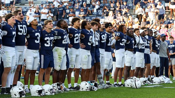 Penn State Nittany Lion players sing their alma mater following the game vs. the Marshall Thundering Herd at Beaver Stadium.
