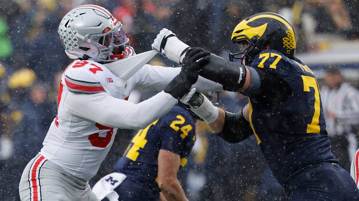 Michigan Wolverines offensive lineman Blake Frazier blocks Ohio State Buckeyes defensive end Kenyatta Jackson Jr. Michigan Wolverines offensive lineman Blake Frazier blocks Ohio State Buckeyes defensive end Kenyatta Jackson Jr.