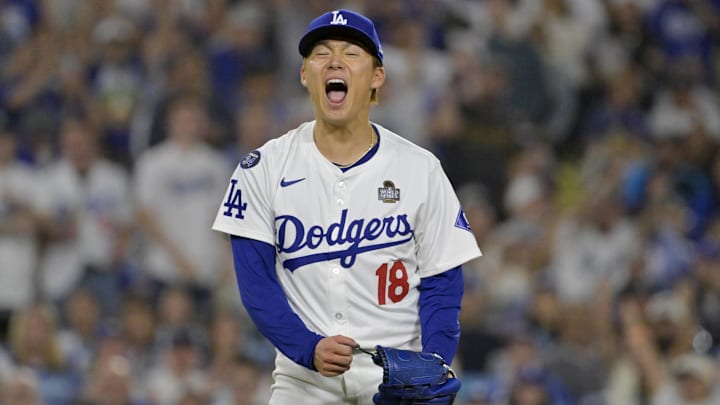 Los Angeles Dodgers pitcher Yoshinobu Yamamoto (18) reacts in the fourth inning against the New York Yankees during Game 2 of the 2024 MLB World Series at Dodger Stadium.
