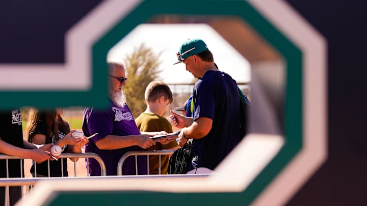 Feb 12, 2026; Phoenix, AZ, USA; Seattle Mariners outfielder Jared Sundstrom signs autographs at Seattle Mariners workouts in Peoria, Arizona. Mandatory Credit: Arianna Grainey-Imagn Images
