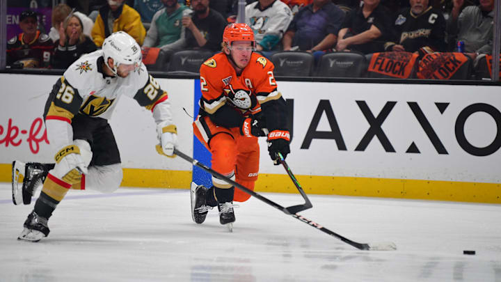May 8, 2026; Anaheim, California, USA; Vegas Golden Knights center Nic Dowd (26) plays for the puck against Anaheim Ducks defenseman Jackson LaCombe (2) during the first period in game three of the second round of the 2026 Stanley Cup Playoffs at Honda Center. Mandatory Credit: Gary A.
Vasquez-Imagn Images