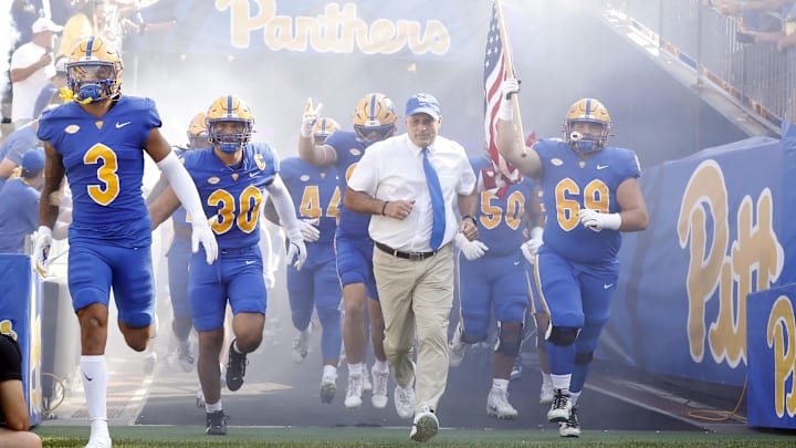 Sep 21, 2024; Pittsburgh, Pennsylvania, USA; Pittsburgh Panthers defensive back Donovan McMillon (3) and linebacker Brandon George (30) and head coach Pat Narduzzi (tie) and offensive lineman Matt Metrosky (69) take the field to play the Youngstown State Penguins against at Acrisure Stadium. Mandatory Credit: Charles LeClaire-Imagn Images Sep 21, 2024; Pittsburgh, Pennsylvania, USA; Pittsburgh Panthers defensive back Donovan McMillon (3) and linebacker Brandon George (30) and head coach Pat Narduzzi (tie) and offensive lineman Matt Metrosky (69) take the field to play the Youngstown State Penguins against at Acrisure Stadium. Mandatory Credit: Charles LeClaire-Imagn Images