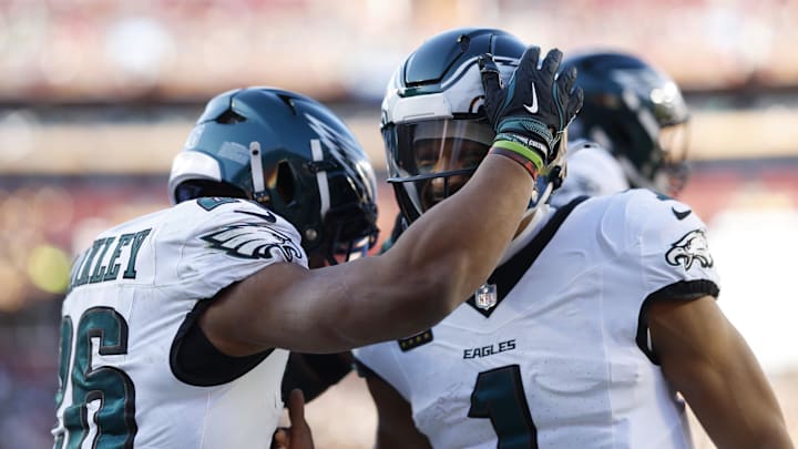 Philadelphia Eagles running back Saquon Barkley and quarterback Jalen Hurts
