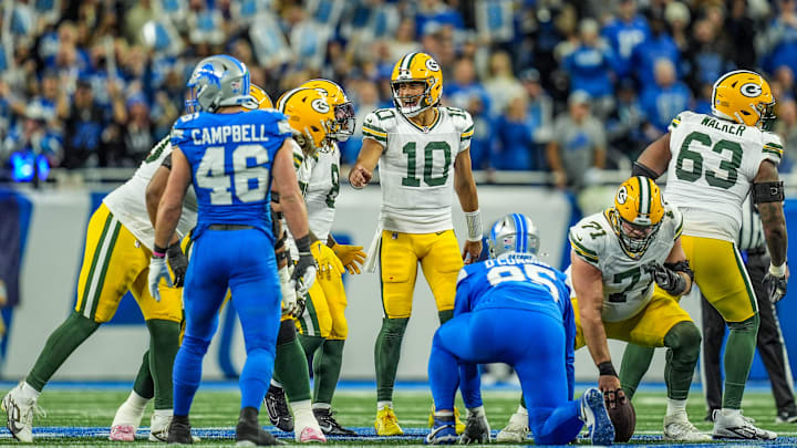 Green Bay Packers quarterback Jordan Love (10) tries to yell out the play over the roar of the crowd at Ford Field.
