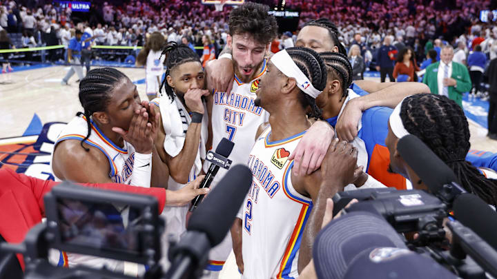 Apr 21, 2024; Oklahoma City, Oklahoma, USA; Oklahoma City Thunder guard Shai Gilgeous-Alexander (2) is met by his teammates during an interview with tv after defeating the New Orleans Pelicans in game one of the first round for the 2024 NBA playoffs at Paycom Center. Mandatory Credit: Alonzo Adams-Imagn Images