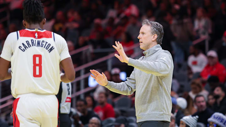 Nov 15, 2024; Atlanta, Georgia, USA; Washington Wizards Head Coach Brian Keefe and Washington Wizards guard Carlton Carrington (8) in the game against the Atlanta Hawks during the first quarter at State Farm Arena. Mandatory Credit: Jordan Godfree-Imagn Images