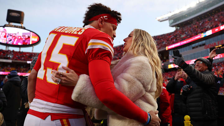 Kansas City Chiefs quarterback Patrick Mahomes (15) and Brittany Mahomes react before the AFC Championship game against the Buffalo Bills at GEHA Field at Arrowhead Stadium.