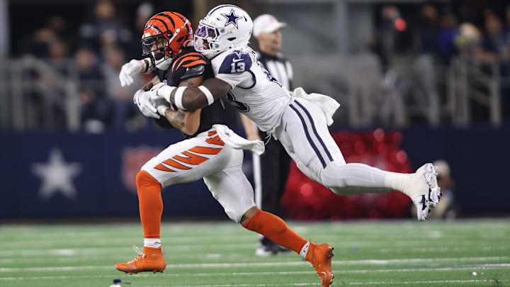 Dec 9, 2024; Arlington, Texas, USA; Dallas Cowboys linebacker DeMarvion Overshown (13) breaks up a pass intended for Cincinnati Bengals running back Chase Brown (30) on fourth down in the second quarter at AT&T Stadium. Mandatory Credit: Tim Heitman-Imagn Images Dec 9, 2024; Arlington, Texas, USA; Dallas Cowboys linebacker DeMarvion Overshown (13) breaks up a pass intended for Cincinnati Bengals running back Chase Brown (30) on fourth down in the second quarter at AT&T Stadium. Mandatory Credit: Tim Heitman-Imagn Images