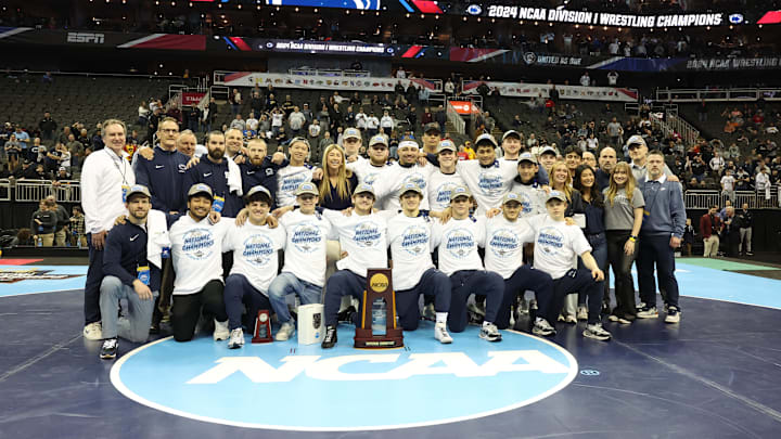 The Penn State Nittany Lions pose with the trophy after winning the team title at the 2024 NCAA Wrestling Championships. The Penn State Nittany Lions pose with the trophy after winning the team title at the 2024 NCAA Wrestling Championships.