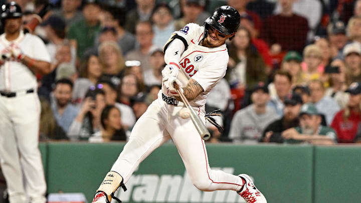 Jun 2, 2025; Boston, Massachusetts, USA; Boston Red Sox outfielder Jarren Duran (16) hits a double against the Los Angeles Angels during the fifth inning at Fenway Park. Mandatory Credit: Brian Fluharty-Imagn Images