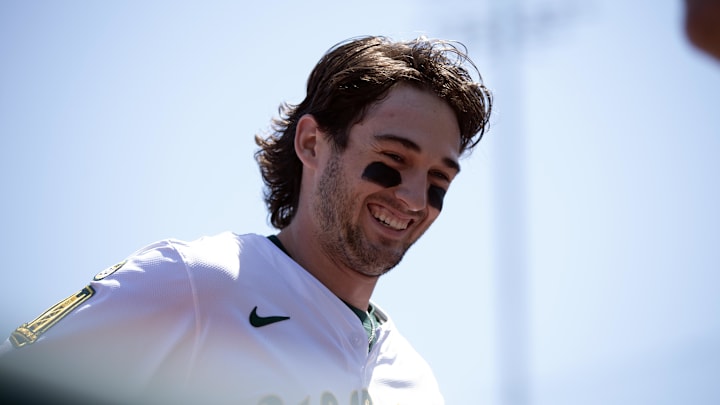 West Sacramento, California, USA; Athletics shortstop Jacob Wilson (5) is all smiles as he returns to the dugout to retrieve his glove during the fourth inning against the Seattle Mariners at Sutter Health Park.
