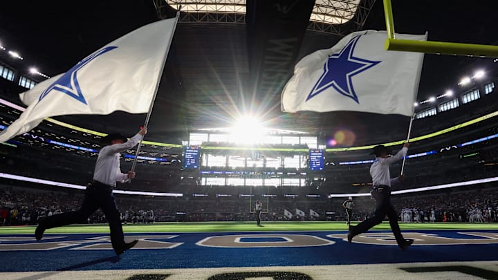 A general view of the field as flag runners run by after a Dallas Cowboys score against the Detroit Lions at AT&T Stadium. 