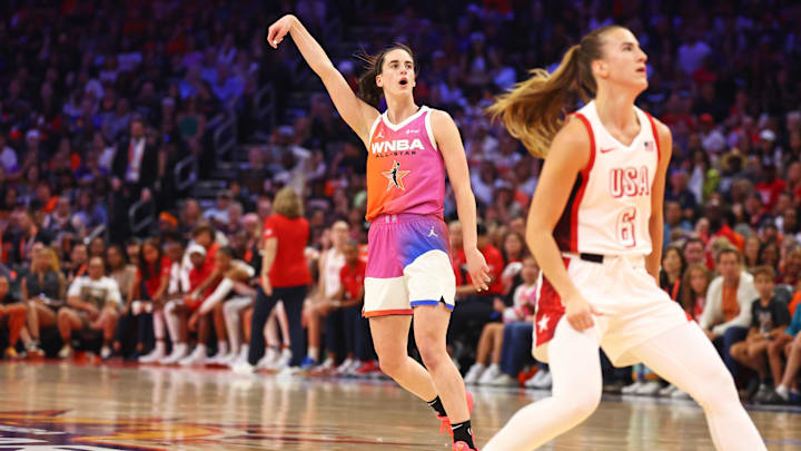 Jul 20, 2024; Phoenix, AZ, USA; Team WNBA guard Caitlin Clark (22) shoots for the basket during the first half against USA Women's National Team guard Sabrina Ionescu (6) at Footprint Center. Mandatory Credit: Mark J. Rebilas-Imagn Images