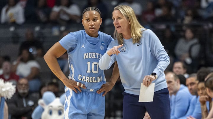 Mar 28, 2025; Birmingham, AL, USA; North Carolina Tar Heels head coach Courtney Banghart works with guard Reniya Kelly (10) during the Sweet 16 NCAA Tournament basketball game against the Duke Blue Devils at Legacy Arena. Mandatory Credit: Vasha Hunt-Imagn Images