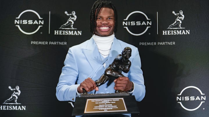Dec 14, 2024; New York, NY, USA; Colorado Buffaloes wide receiver/cornerback Travis Hunter poses for a photo after winning the Heisman Trophy award during the 2024 Heisman Trophy Presentation. Mandatory Credit: Lucas Boland-Imagn Images