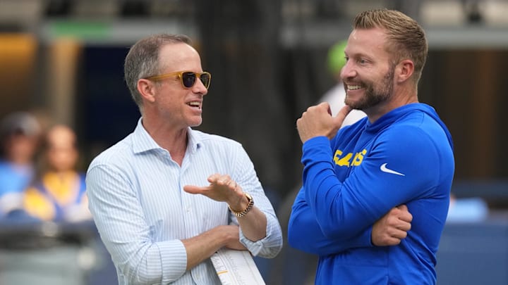 Aug 16, 2025; Inglewood, California, USA; Los Angeles Chargers president of football operations John Spanos (left) and Los Angeles Rams coach Sean McVay talk during the game at SoFi Stadium. Mandatory Credit: Kirby Lee-Imagn Images