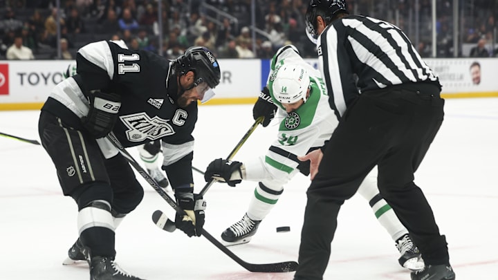 Dec 4, 2024; Los Angeles, California, USA; Los Angeles Kings center Anze Kopitar (11) faces off against Dallas Stars left wing Jamie Benn (14) during the third period of a hockey game at Crypto.com Arena. Mandatory Credit: Jessica Alcheh-Imagn Images