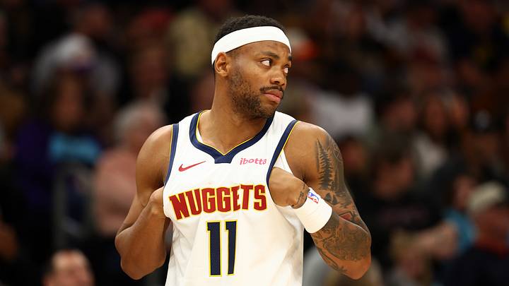 Nov 29, 2025; Phoenix, Arizona, USA; Denver Nuggets guard Bruce Brown (11) against the Phoenix Suns at the Mortgage Matchup Center. Mandatory Credit: Mark J. Rebilas-Imagn Images