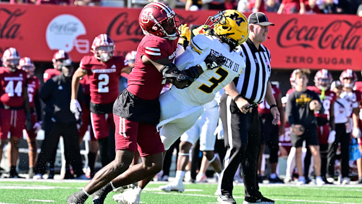 Oct 12, 2024; Amherst, Massachusetts, USA; Massachusetts Minutemen safety Tyler Rudolph (4) tackles Missouri Tigers wide receiver Luther Burden III (3) during the second half at Warren McGuirk Alumni Stadium. Mandatory Credit: Eric Canha-Imagn Images