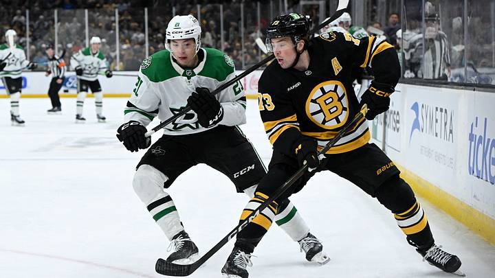 Mar 31, 2026; Boston, Massachusetts, USA; Boston Bruins defenseman Charlie McAvoy (73) passes the puck in front of Dallas Stars left wing Jason Robertson (21) during the second period at the TD Garden. Mandatory Credit: Brian Fluharty-Imagn Images Mar 31, 2026; Boston, Massachusetts, USA; Boston Bruins defenseman Charlie McAvoy (73) passes the puck in front of Dallas Stars left wing Jason Robertson (21) during the second period at the TD Garden. Mandatory Credit: Brian Fluharty-Imagn Images