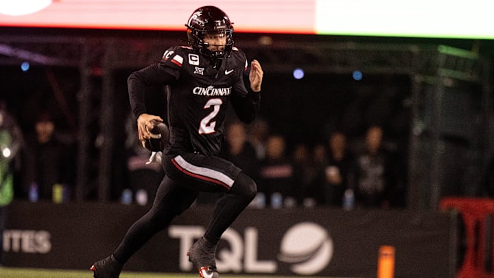 Cincinnati Bearcats quarterback Brendan Sorsby (2) runs for a first down in the fourth quarter Cincinnati Bearcats quarterback Brendan Sorsby (2) runs for a first down in the fourth quarter