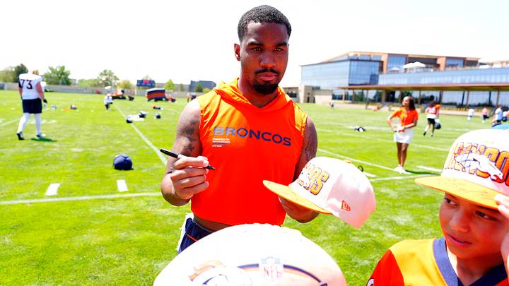 Jul 31, 2026; Englewood, CO, USA; Denver Broncos wide receiver Jaylen Waddle (17) signs autographs following training camp at Broncos Park. Jul 31, 2026; Englewood, CO, USA; Denver Broncos wide receiver Jaylen Waddle (17) signs autographs following training camp at Broncos Park.