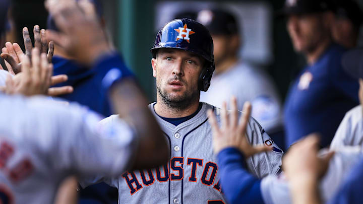 Sep 4, 2024; Cincinnati, Ohio, USA; Houston Astros third baseman Alex Bregman (2) high fives teammates after scoring on a RBI single hit by outfielder Ben Gamel (not pictured) in the second inning against the Cincinnati Reds at Great American Ball Park. Mandatory Credit: Katie Stratman-Imagn Images