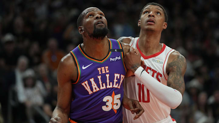 Mar 30, 2025; Phoenix, Arizona, USA; Phoenix Suns forward Kevin Durant (35) and Houston Rockets forward Jabari Smith Jr. (10) fight for position in the first half at Footprint Center. Mandatory Credit: Rick Scuteri-Imagn Images