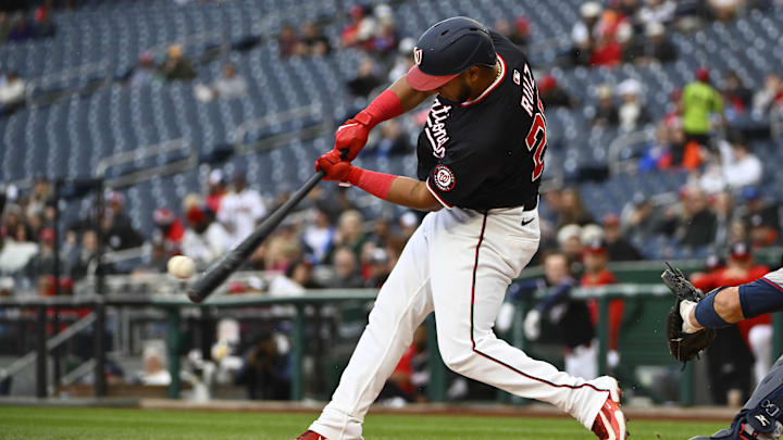 Washington, District of Columbia, USA; Washington Nationals catcher Keibert Ruiz (20) hits a RBI double against the Atlanta Braves during the first inning at Nationals Park. Washington, District of Columbia, USA; Washington Nationals catcher Keibert Ruiz (20) hits a RBI double against the Atlanta Braves during the first inning at Nationals Park.